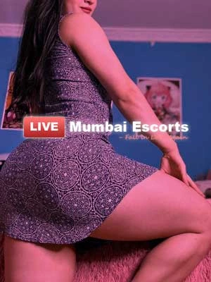 Glam Doll in short grey skirt showing her thighs