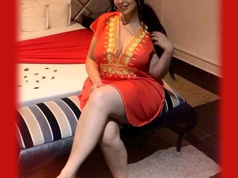 beautiful woman sitting on bed